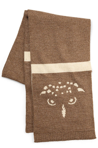 Brown knitted scarf with a white owl design on a white background